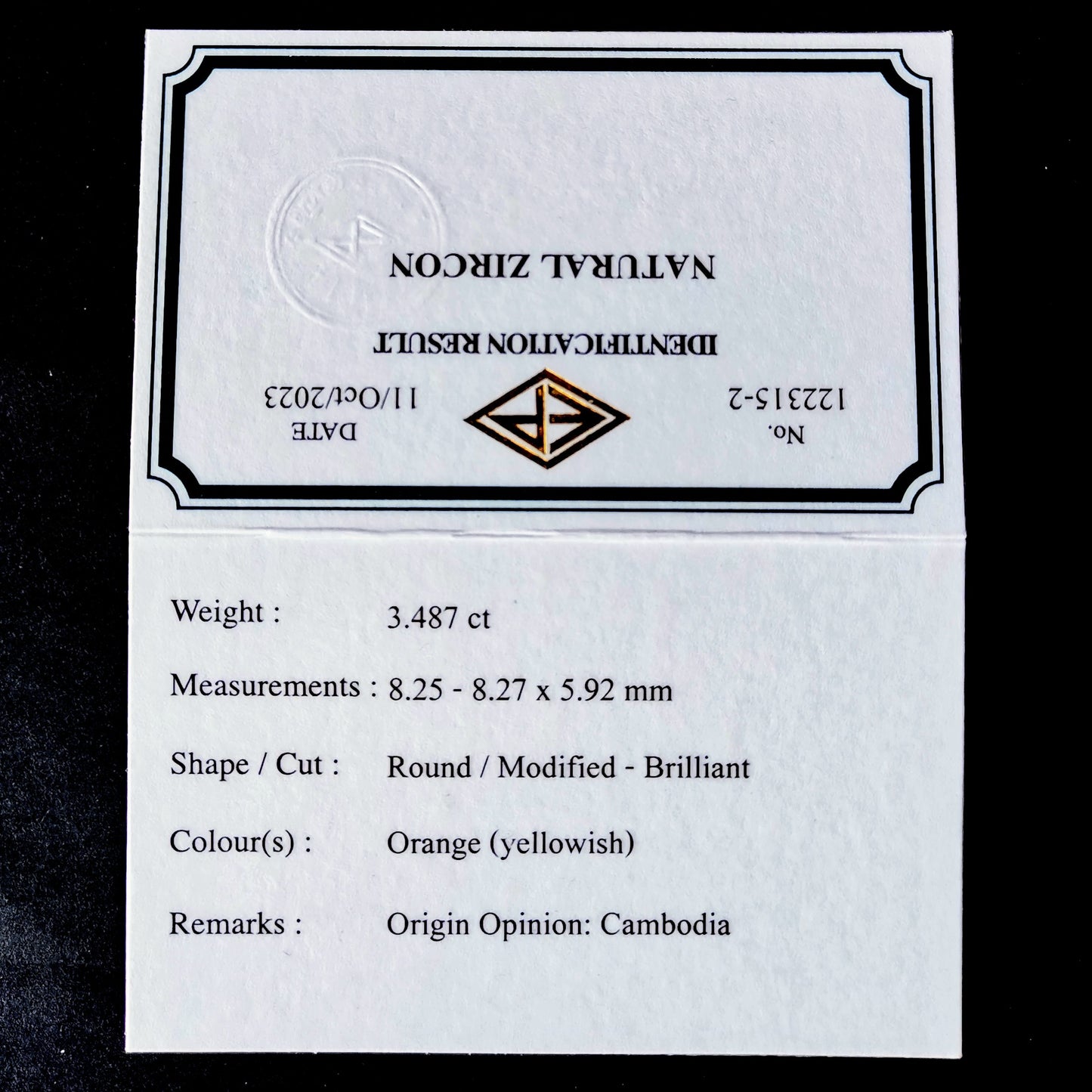 秋色強く感じるカボチャ(色溜まり)覗く美しい一石 / ジルコン 3.487ct